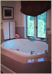 The master bathroom tub is given its own dormer window position.