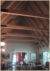 The living room uses existing roof joists with new cross ties then added.