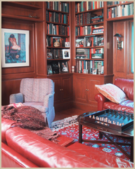 The library, with cherry wood paneling and cabinets.