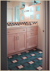 The new bathroom uses mosaic tiles in a special pattern conceived by the owners.