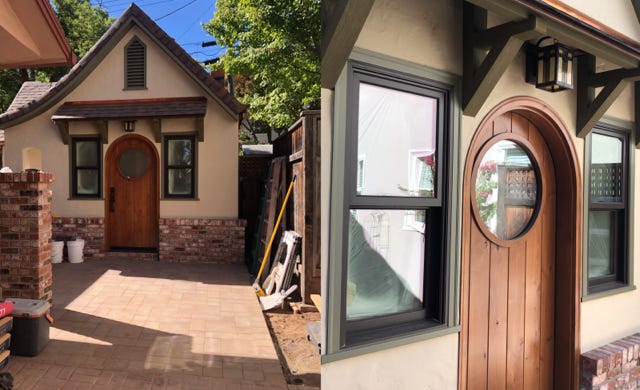 construction photos showing new custom fabricated front door design