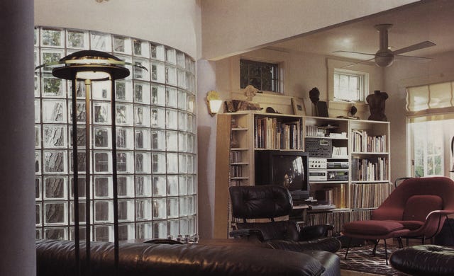 new residential addition with glass block exterior to save existing tree